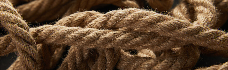 close up view of rope on black background, panoramic shot