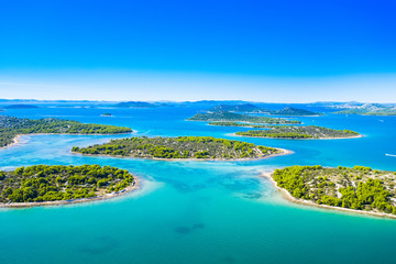 Fototapeta na wymiar Croatian coastline, small islands in Murter archipelago, aerial view of turquoise bays from drone, touristic paradise on Adriatic sea