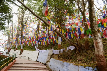 Colorful buddhism prayer flags in Mahakal temple on the Observatory hill, colorful prayer buddhist flags, Darjeeling, India