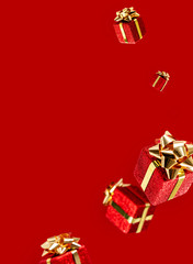 Gifts are flying in the air on a red background. Sale. Levitation concept. Christmas layout with copy space.