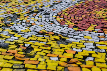 Fragment of an old wall olor mosaic close-up. Smalt..