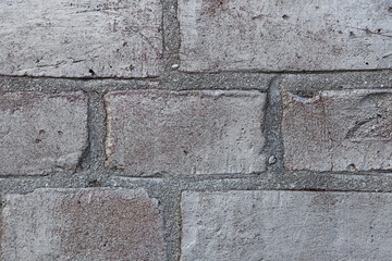 Background with stone wall of silver painted bricks as closeup, copy space