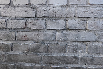 Texture of stonewall with silver sprayed bricks, background with copy space