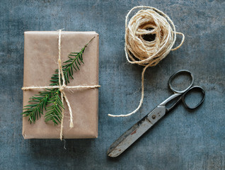 Gift package wrapped with kraft paper tied with a rope