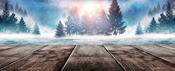 Washable wall murals Cappuccino Winter background. Winter snow landscape with wooden table in front. Dark winter forest background at night. Snow, fog, moonlight. Dark neon night background in the forest with moonlight.