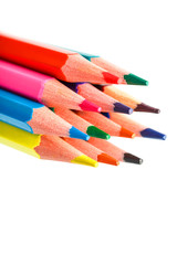 Colored pencils close up on white background, free space for text.