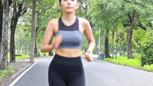 Asian woman stretching warming up and jogging ,Sport concept