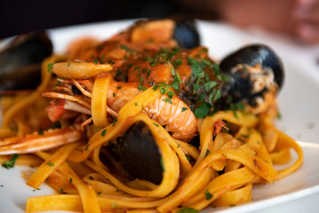 linguine with tomato sauce with scampi and mussels