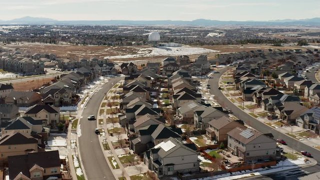 Aerial footage flying over a large residential neighborhood, in Southeast Aurora Colorado, approaching a Radome satellite and shell. These are also referred to as "Buckley balls."