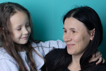 Studio photo of a young girl in glasses on a colored background