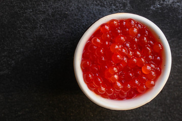 red caviar (seafood, salmon caviar) menu concept. food background. top view. copy space