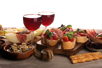 Italian antipasti wine snacks set. Cheese variety, Mediterranean olives, seafood salad, Prosciutto...