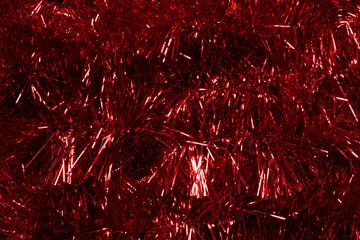 Abstract red background of Christmas decorative tinsel 