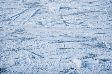 Fototapeta na wymiar Blue ice with skate scratches