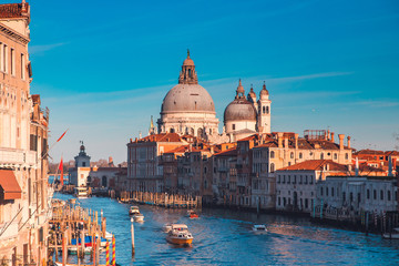 Obraz premium Cathedral Santa Maria della Salute tourists on gondola Grand Canal of Venice sunset, Italy
