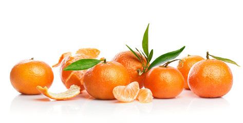 Ripe tangerines with green leaf in cut. Fruity still life citrus. Isolated on white background.