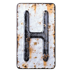 3D render capital letter H made of forged metal on the background fragment of a metal surface with cracked rust.