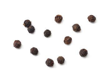 Black peppercorn isolated on white background. top view