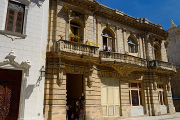 Historical architecture in Old Havana Cuba with storefront and appartments upstairs