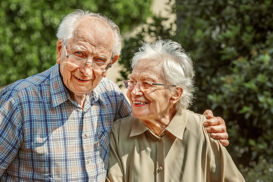 Elderly Couple Standing Together Outside
