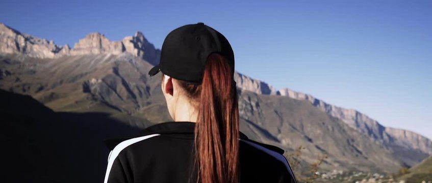 beautiful girl walking in the mountains.anamorph