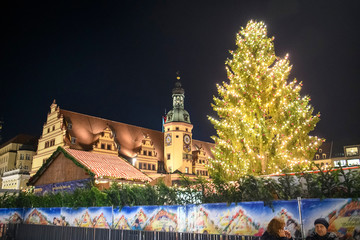 Christmas market at Marktplatz Market square in front of the Old Town Hall at dusk. LEIPZIG,...