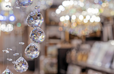Hanging crystal balls in a modern chandelier.