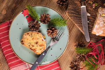Traditional Christmas cake with candied fruit, raisins and fruits. Shallow depth of field.