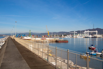 Italy, Tuscany: view of the port in Marina di Carrara and in the background the Apuan Alps with the marble quarries