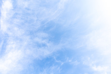 Beautiful blue clear sky with white clouds background in sunny day and copy space. Nature bright sky background image. Summer blue sky. Texture for Design. Natural cloudy Wallpaper.
