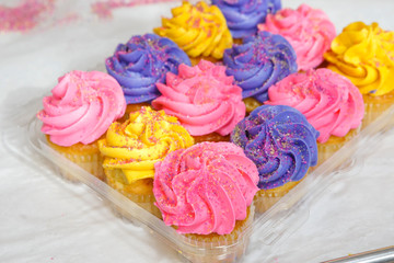 Festive variety of cupcakes with frosting and sprinkles