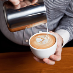 Barista make coffee cup latte art