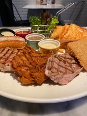 grilled steak with french fries and beer