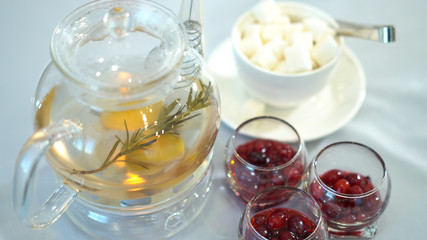 Tea in a heated glass jar awaits its taste.