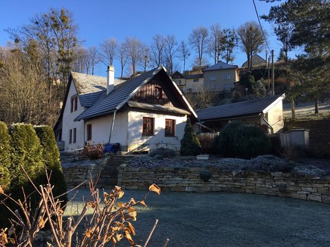 View of traditional Czech cottage covered with frost