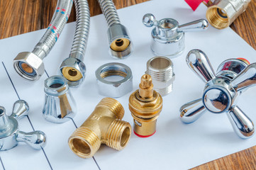 Spare parts and accessories for plumbing repair on a note sheet