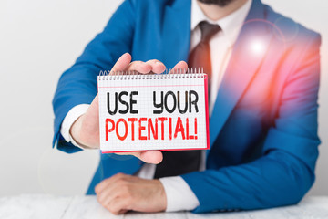 Conceptual hand writing showing Use Your Potential. Concept meaning achieve as much natural ability makes possible Man holds empty paper with copy space in front of him Space