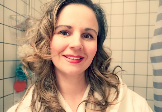 Portrait Of Beautiful Mature Woman In Bathrobe Getting Ready To Take A Bath.