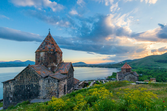 Shooting of Sevanavank Monastery dramatic sky at sunset, Armenia