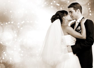 Happy just married young couple on dark vintage background