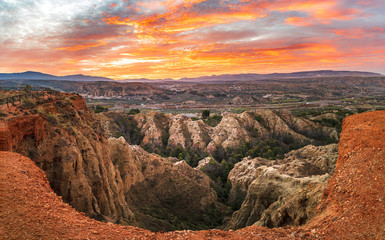 Stormy badlands landscape in Purullena. Guadix region. Province of Granada. Andalusia. South Spain