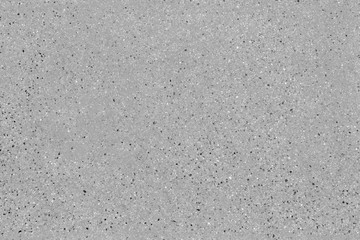 Seamless asphalt road background. Grainy concrete texture with gravel particles, small stones,...