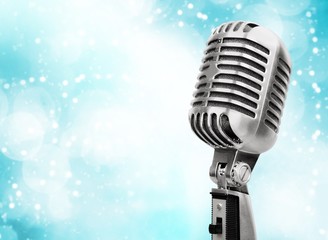 Vintage retro silver microphone on background