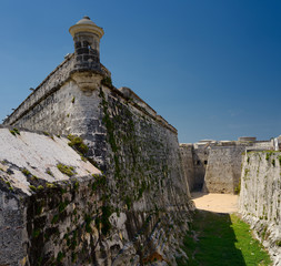 Fototapeta na wymiar Fortified walls and dry moat of Morro Castle fortress guarding Havana Bay Cuba