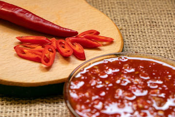 ketchup in a bowl and chopped hot peppers