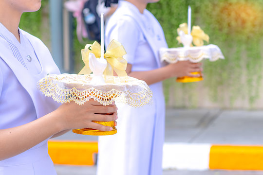 Portrait Of A Nurse Holding A White Candle Tray