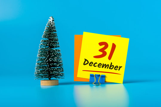 December 31st. Image 31 day of december month, calendar with Christmas tree on blue background. New year 2020