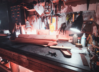Big variety of tools at leather master's cabiet.