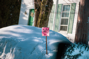 Pink party sign in large snowbank