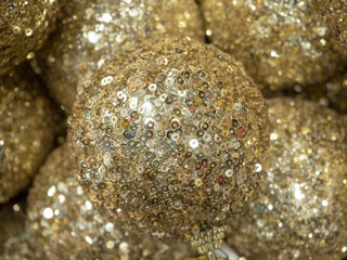 Golden Christmas ball closeup. New year concept, new year background
